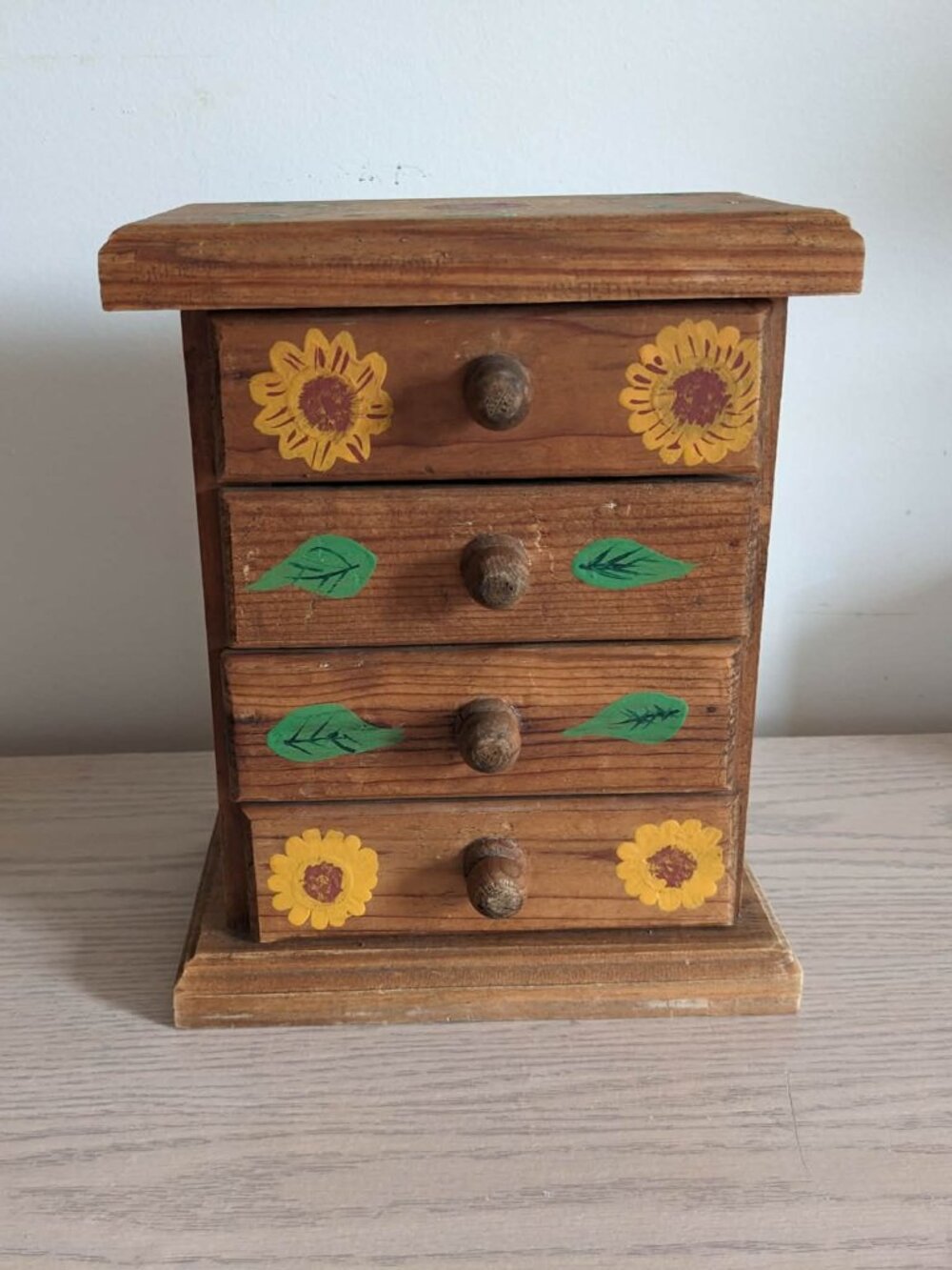 Small Wooden storage box with drawers.